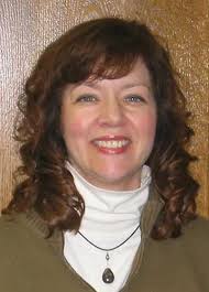 Card player cuts deck of fat quarters into traditional quilts