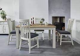 The table extends by sliding out the two. Extending Dining Tables Furniture Village