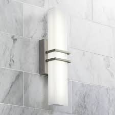 This armed sconce features a brushed nickel finish that will complement many transitional decors. Brushed Nickel Sconces Lamps Plus