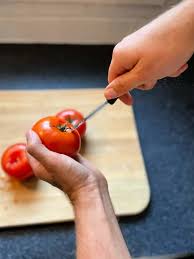 Use your knife to slice from the top of the tomato toward the bottom. 1 Minute How To Core A Tomato Loaves And Dishes