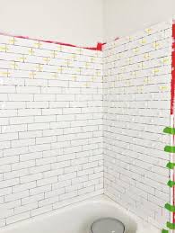 How much redgard to use: A Diyer S Guide To Waterproofing And Tiling A Bathtub Shower White Subway Tile Bathroom Tile Tub Surround Master Bathroom Tub