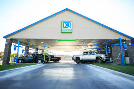 This is small (2 bay) touchless carwash tucked away across the street from the bowling alley. Iq Car Wash
