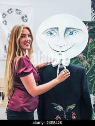 London, UK. 26th June, 2024. Holly Munro from Edinburgh College of Art with  her lightweight metal lamp designs. Graduates show their creations at New  Designers design graduate show at the Business Design