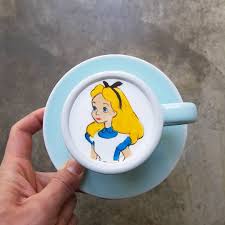 Screenshot from how to create latte art. Barista Takes Coffee To The Next Level With Colored Latte Art
