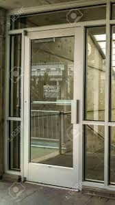 All our aluminium entrance doors now come with the best performing cylinder on the market. Vertical Crop Glass Door And Wall With View Of Slanted Frosted Stock Photo Picture And Royalty Free Image Image 149198591