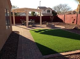 A mediterranean garden design is characterized by stone structures and an arbor. Arizona Backyard Landscape Design Design And Style