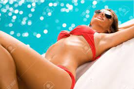 Sexy Girl Sunbathing On The Beach Stock Photo, Picture and Royalty Free  Image. Image 12150758.