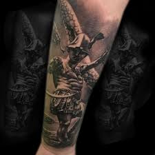 Black And Grey Realism Tattoo Artists Near Me Gladiator In Fight Tattoo Done By Mike To See More Of Mike S Work Or To Book In For A Consultation Follow The Link Tattoos Tattoo Artists Portrait Tattoo