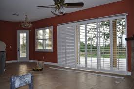 As a design shutters llc dealer, we have a great selection of shutters for you to choose from, made right here in phoenix, az. Sliding Shutters Bypass Is A Multiple Shutter Track System Contemporary Living Room Orlando By Gator Blinds Houzz