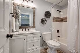 40 wonderful white bathroom ideas. Lovely White Bathroom Design With Reclaimed Wood Details Compact Bathroom Features Vanity Cabinet With Marble Counter Top And Tub And Shower Combo Accented With Wood Border Northwest Usa Stock Photo Picture And