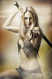 Fantasy Portrait Of Medieval Woman Fighter With Sword In Sexy Armour  Pointing At Camera. Joan Of Arc Stock Photo, Picture And Royalty Free  Image. Image 10504833.