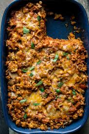 Add the water and taco seasoning. Layered Chicken Enchilada Casserole Healthy Seasonal Recipes