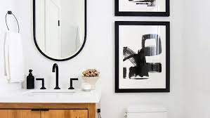 Painting this bathroom door black really makes this bathroom stand out from the rest. The 7 Best Small Bathroom Paint Colors