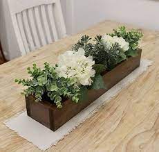 A centerpiece is the must have for the dining tables either you are dining on it or not. 20 Wooden Box Planters Ideas For Centerpieces Decor Farmhouse Table Centerpieces Rustic Wooden Box Centerpiece Wooden Box Centerpiece