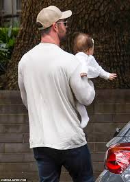 Chris Hemsworth shows off his paternal side as he cradles pal's baby  daughter