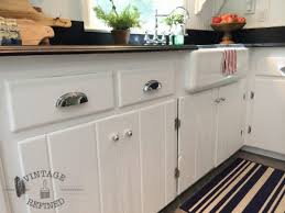 They look five million times. Remodelaholic Kitchen Renovation Updating Knotty Pine Cabinets