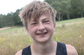 Cross country teams compete under the lights