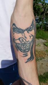 Joker smile tattoo batman joker tattoo left arm tattoos wolf tattoos body art tattoos tattoo design drawings tattoo sketches why so serious tattoo joker cartoon. Joker Tattoo Photos Free Royalty Free Stock Photos From Dreamstime