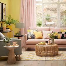 18 Colors That Are The Perfect Compliment To Yellow Pink Sofa Living Room Pink Sofa Living Yellow Decor Living Room