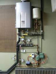 How To Heat A Garage Exploring Some Low Cost Options For Keeping An Attached Garage Comfortable Pictured Hydron Garage Heater Heated Garage Hydronic Heating