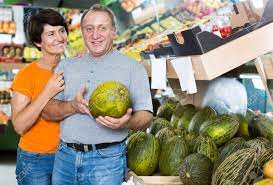 Happy Man And His Wife Are Choosing Ripe Melon Stock Photo, Picture And  Royalty Free Image. Image 174210814.