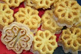 With lots of smoked fish, aquavit, and a centerpiece ham. Rosette Cookie Wikipedia