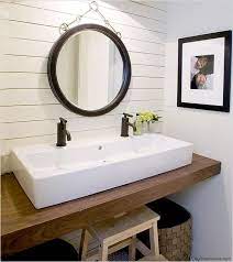 A double trough sink bathroom vanity has basins recessed directly into its countertop, making it an easy clean option. 5 Bathroom Sinks Trends To Try Double Vanity Bathroom Small Master Bathroom Farmhouse Bathroom Vanity