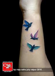 Birds In Flight Tattoo Coloured Flying Bird Tattoo For Girl Tattoo On Wrist Done At Crazyink Tattoo Studio Raipur Colou Bird Tattoos For Women Bird Tattoo Wrist Little Bird Tattoos