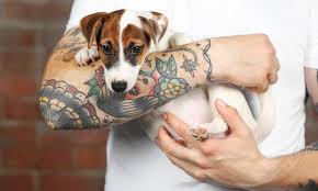 The pet is laid to rest in a beautiful bed of flowers. Forever Remembered 42 Incredible Dog Memorial Tattoos The Dogington Post