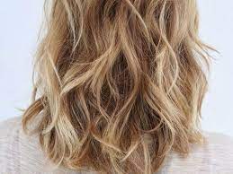 Long hair has a reputation for making women look younger, as it's associated with youthfulness, fertility, and health. The Haircuts For Frizzy Hair That Will Help Ease The Problem Society19 Uk