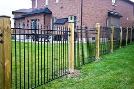 Spike Topped Metal Fence With Wood Posts Metal Fence Fence Gate Design Fence Design