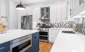 A neutral color palette such as the one in this kitchen backsplash can warm up a sleek, contemporary space. Kitchen Design Trends For 2020