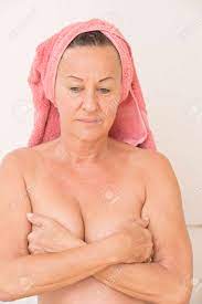 Portrait Attractive Mature Woman Naked With Towel On Head And Covering Her  Breasts With Hands, With Sad, Worried And Concerned Facial Expression,  Isolated On White. Stock Photo, Picture and Royalty Free Image.