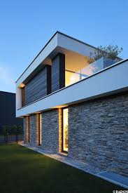 Einfamilienhaus Pool Flachdach Steinfassade Panoramafenster Dachterrasse Fliesenboden Parkett Innenhof Freisitz Glasbalkon Wom Architektur Und Bau Gmbh