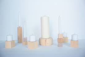 These wood candle holders could be put together as a dining table centerpiece or separately on the shelves throughout the house. Diy Wood Block Candlesticks