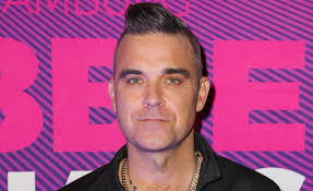 Robbie Williams Surprises Fans With New Hair Style Entertainment Daily