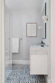 When marble tile bathroom ideas are applied, the visual texture is a strong selling point. Black And White Marble Geometric Bath Floor Tiles Transitional Bathroom