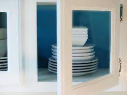 Today i'm sharing a super quick and easy diy to transform your a black iron frame with windowpane detail contrasts a stark white interior for a fresh twist on traditional cabinetry. Update Kitchen Cabinets With Glass Inserts Hgtv