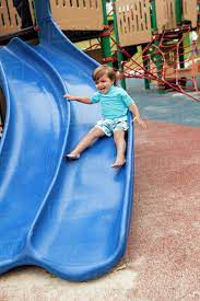Annual family camping trip leads to incest. Mixed Race Boy Sliding Down Slide In Playground Stock Photo Dissolve