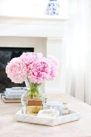 Flower arrangements and books are versatile decorative accessories that can be used with anything you like, offering many creative table centerpiece ideas. Marble Tray Three Ways Monika Hibbs Marble Tray Marble Decor Decorating Coffee Tables