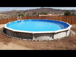 Above Ground Pool Dropped Into Ground With Retaining Wall Swimming Pool Installation Time In 2020 Installing Above Ground Pool Best Above Ground Pool Pool Installation
