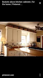 View this charming antique kitchen. Baskets Above Cabinets Above Kitchen Cabinets Decorating Above Kitchen Cabinets Diy Kitchen Decor