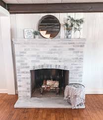 Step 3 mix equal parts paint with water in a bucket. Diy Whitewashed Brick Fireplace Step By Step Tutorial Mainely Katie