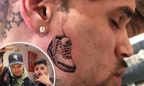 You would think a guy like chris brown, could get an amazing tattoo artist but yet his new neck tattoo looks so bad. Chris Brown Gives Fans A Closer Look At His New Face Tattoo Of An Air Jordan Sneaker Daily Mail Online