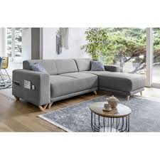 Il dispose d'un grand coffre de rangement situé sous la méridienne, et d'un matelas escamotable sous l'assise du canapé, permettant un couchage. Canape Angle Convertible Reversible Rue Du Commerce