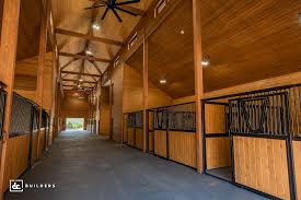 Horse barn built in a traditional timber frame structure also provides a riding arena space and living space on 2nd floor. Horse Barn Builders Dc Builders