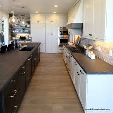 The black base below is simple and striking, while the white uppers and shelving keep the space looking bright and airy. Remodelaholic Grey And White Kitchen Cabinet Ideas