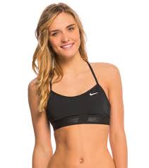 You're in your workout class, sweaty what is a sports bra and how is it different than a regular bra? Nike Women S Solids Racerback Sport Bra Bikini Top At Swimoutlet Com Free Shipping Sports Bra Bikini Top Nike Women Bikini Tops