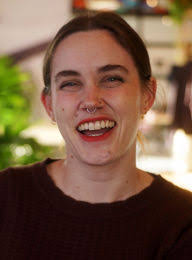 AJ Braun signs her romantasy OF BLOOD & STONE