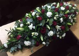 The lily is a highly universal flower that's suitable for any occasion. Red White Funeral Coffin Spray Funeral Casket Flowers